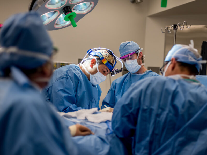 Surgeon, Dr. Golshan (with headlamp) performing a Breast Surgery at BWH.